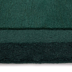 Stacked Borders Evening Blue Rug- a 100% two toned wool rug in dark green.