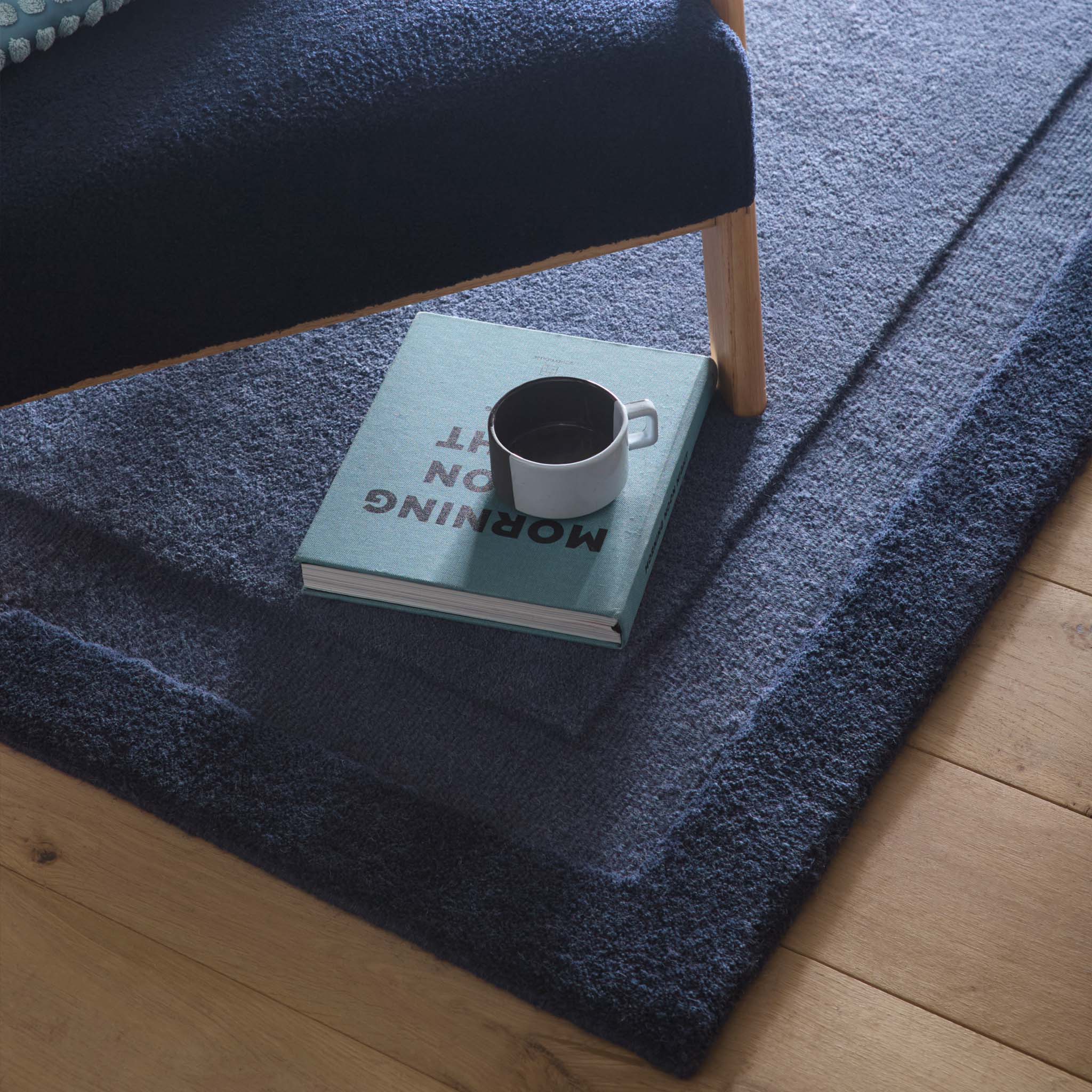Stacked Borders Evening Blue Rug- a two toned 100% wool rug in blue.