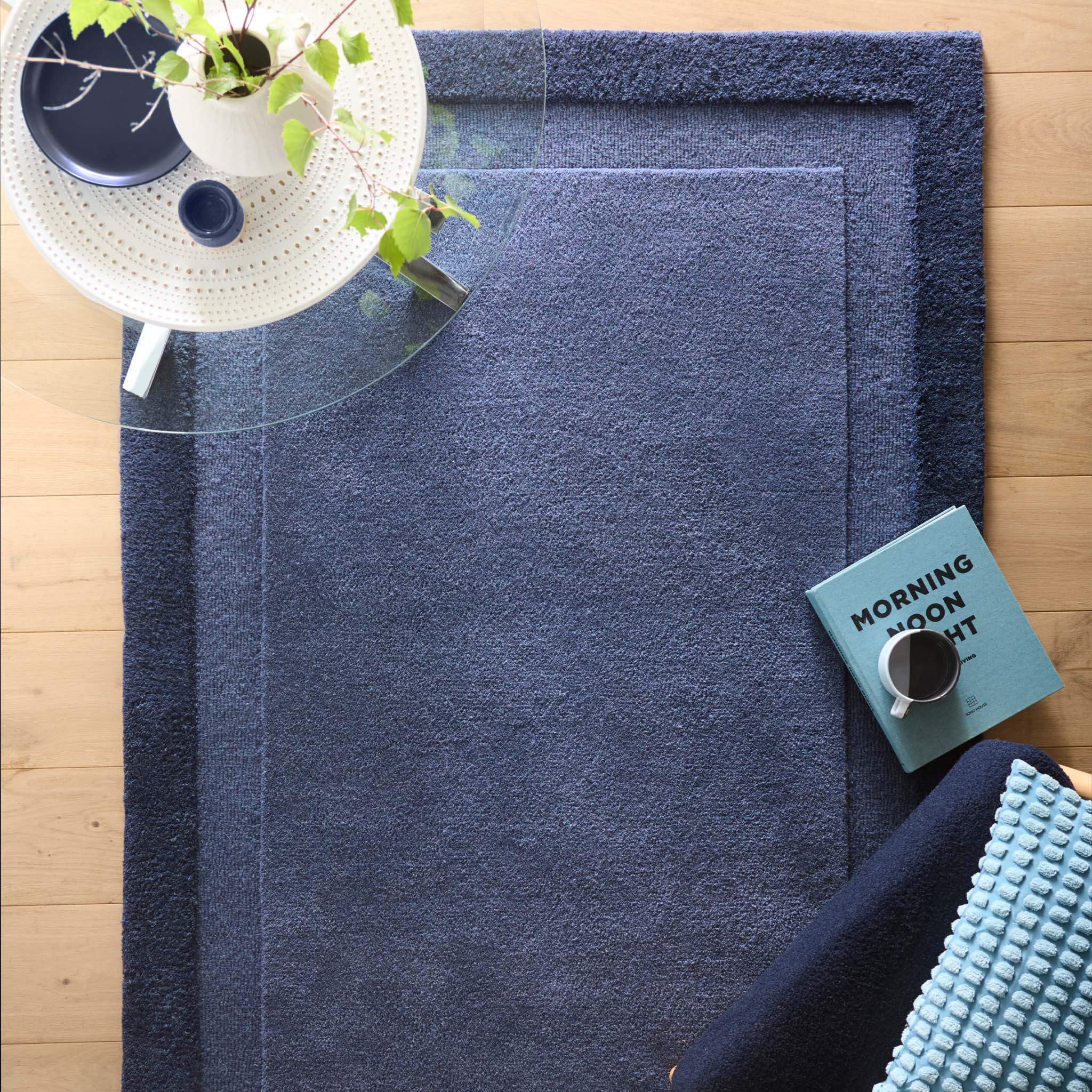 Stacked Borders Evening Blue Rug- a two toned 100% wool rug in blue.