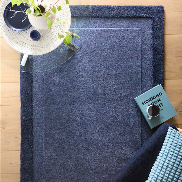 Stacked Borders Evening Blue Rug- a two toned 100% wool rug in blue.