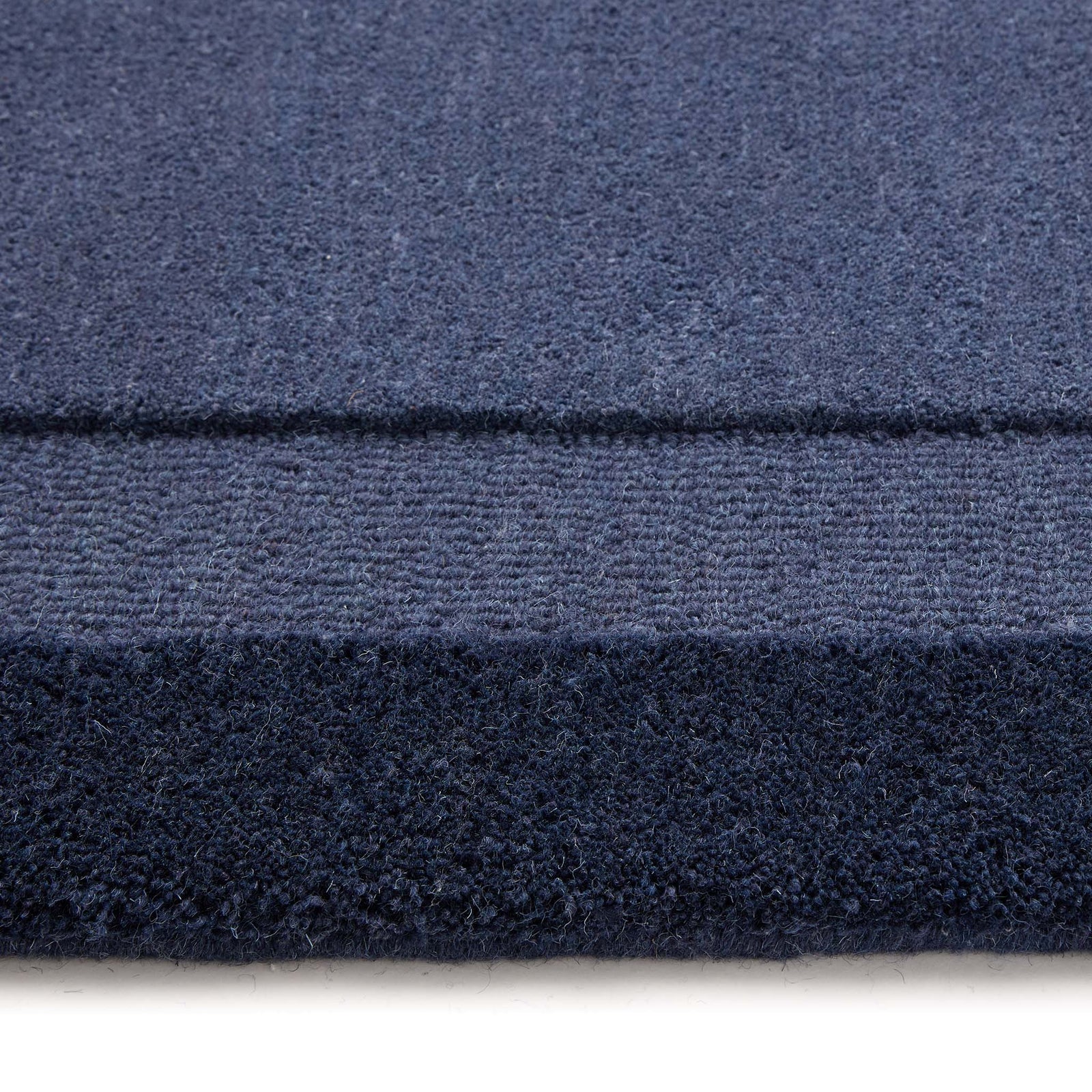 Stacked Borders Evening Blue Rug- a two toned 100% wool rug in blue.