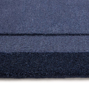 Stacked Borders Evening Blue Rug- a two toned 100% wool rug in blue.