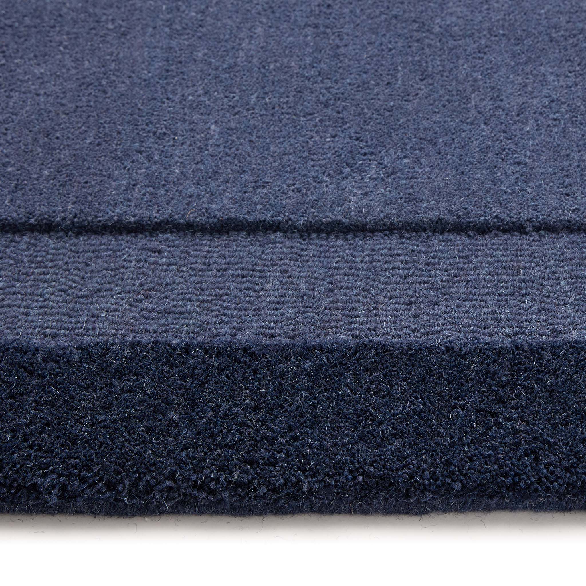 Stacked Borders Evening Blue Rug- a two toned 100% wool rug in blue.