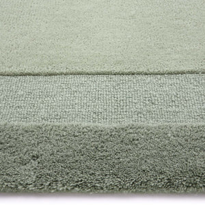 Stacked Borders Soft Green Rug. Made from 100% wool featuring a border design.