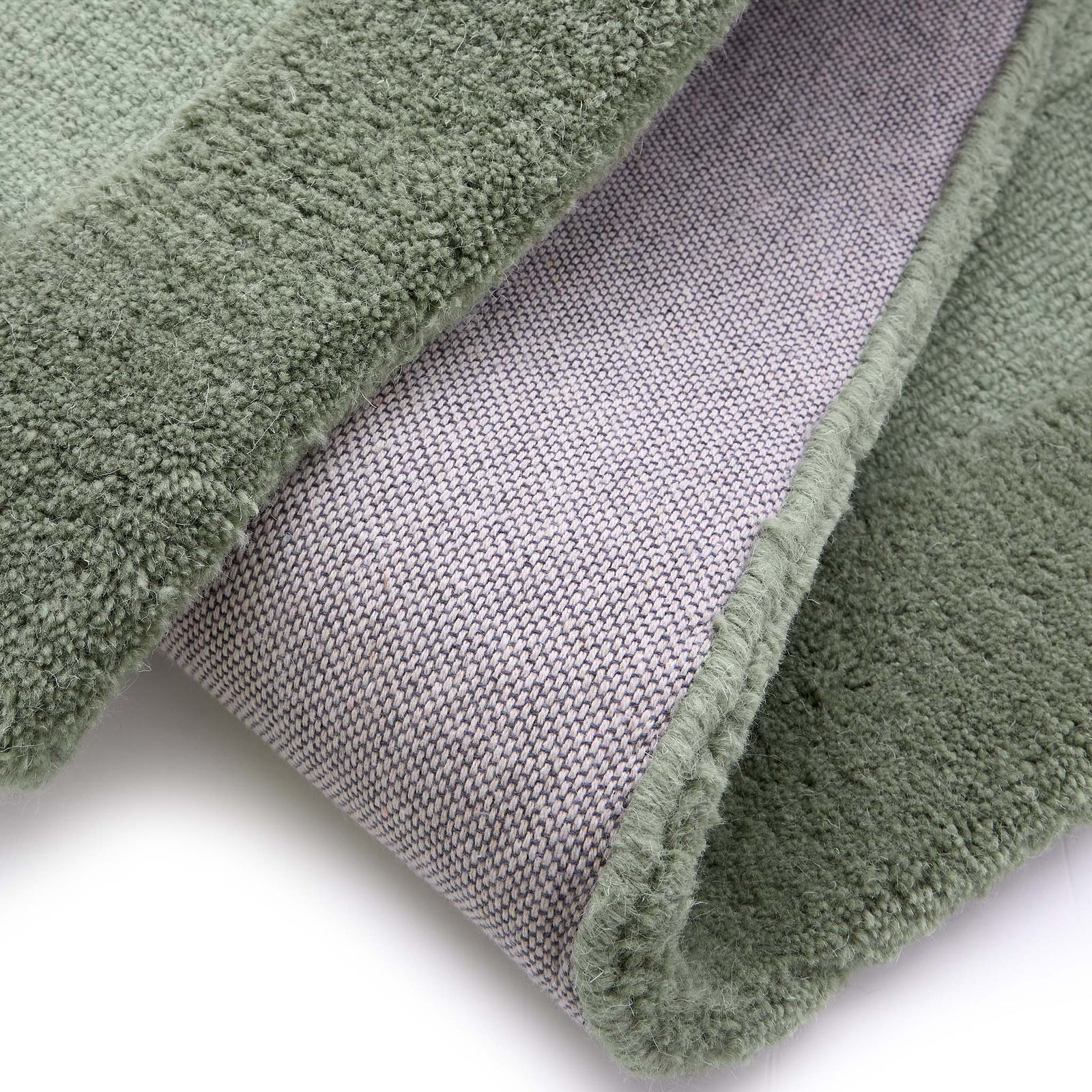 Stacked Borders Soft Green Rug. Made from 100% wool featuring a border design.