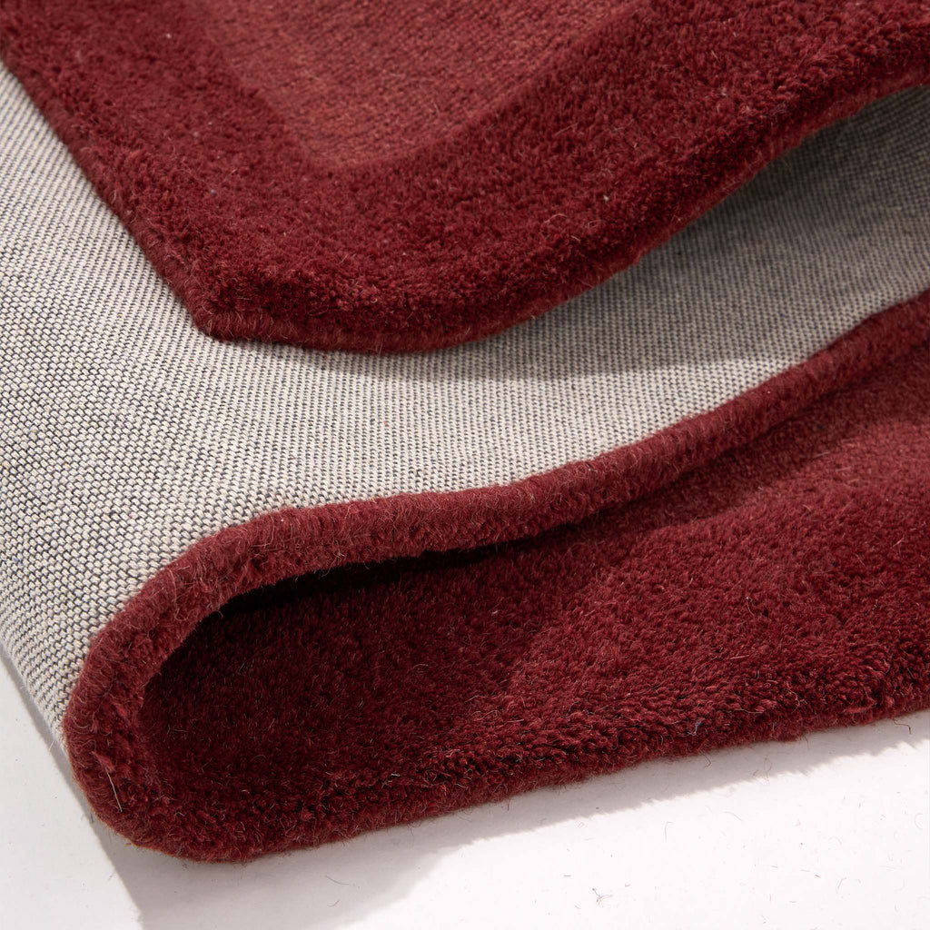 Stacked Borders Wine Red Rug- 100% wool rug with two shades of red. 
