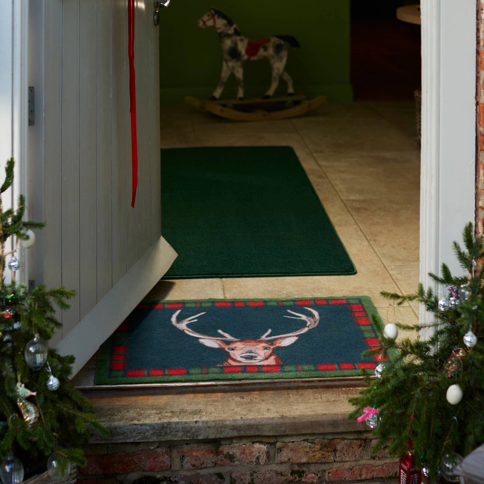 Tartan Stag Washable Doormat made from 100% recycled cotton, featuring a stag surround by a tartan border. 