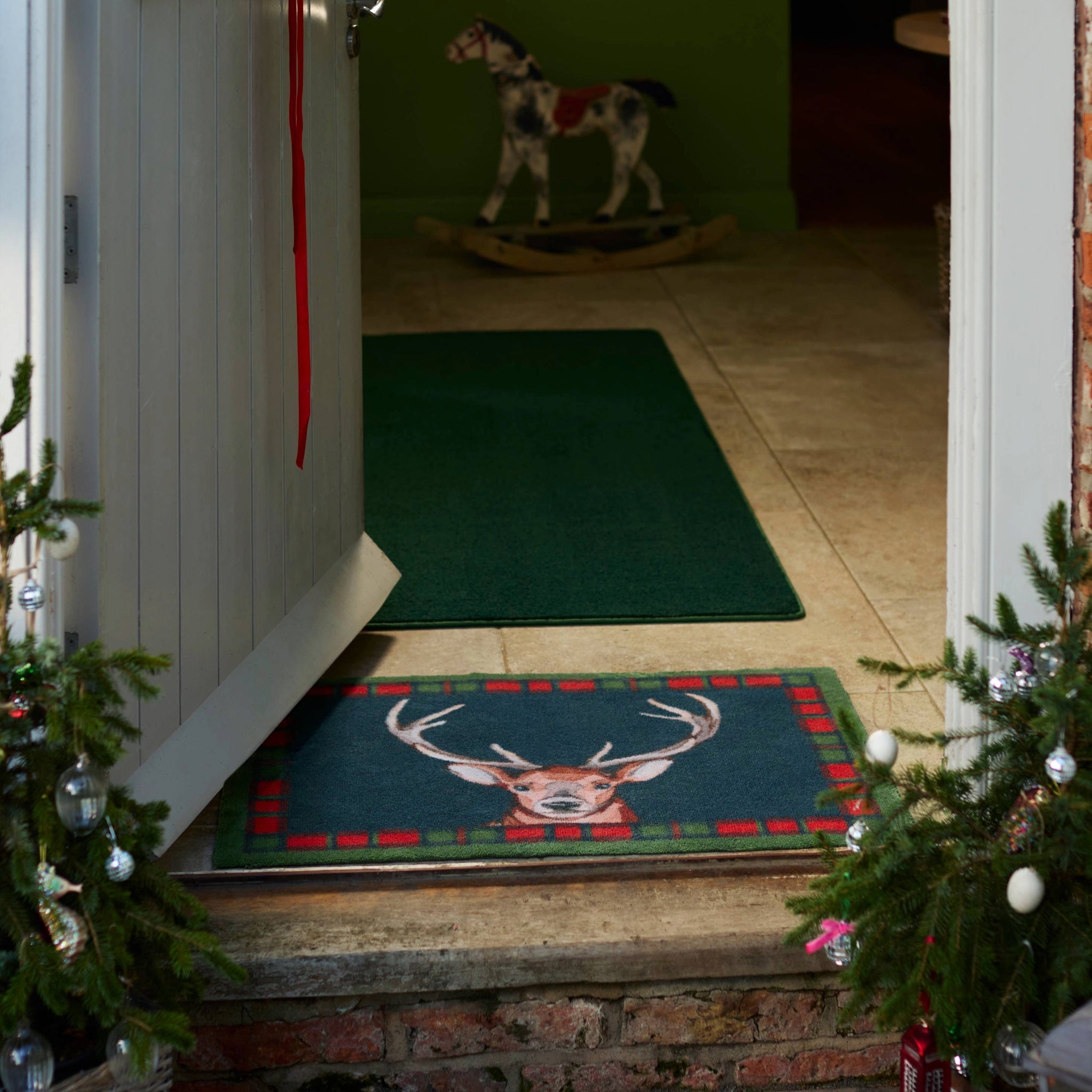 Tartan Stag Washable Doormat made from 100% recycled cotton, featuring a stag surround by a tartan border. 