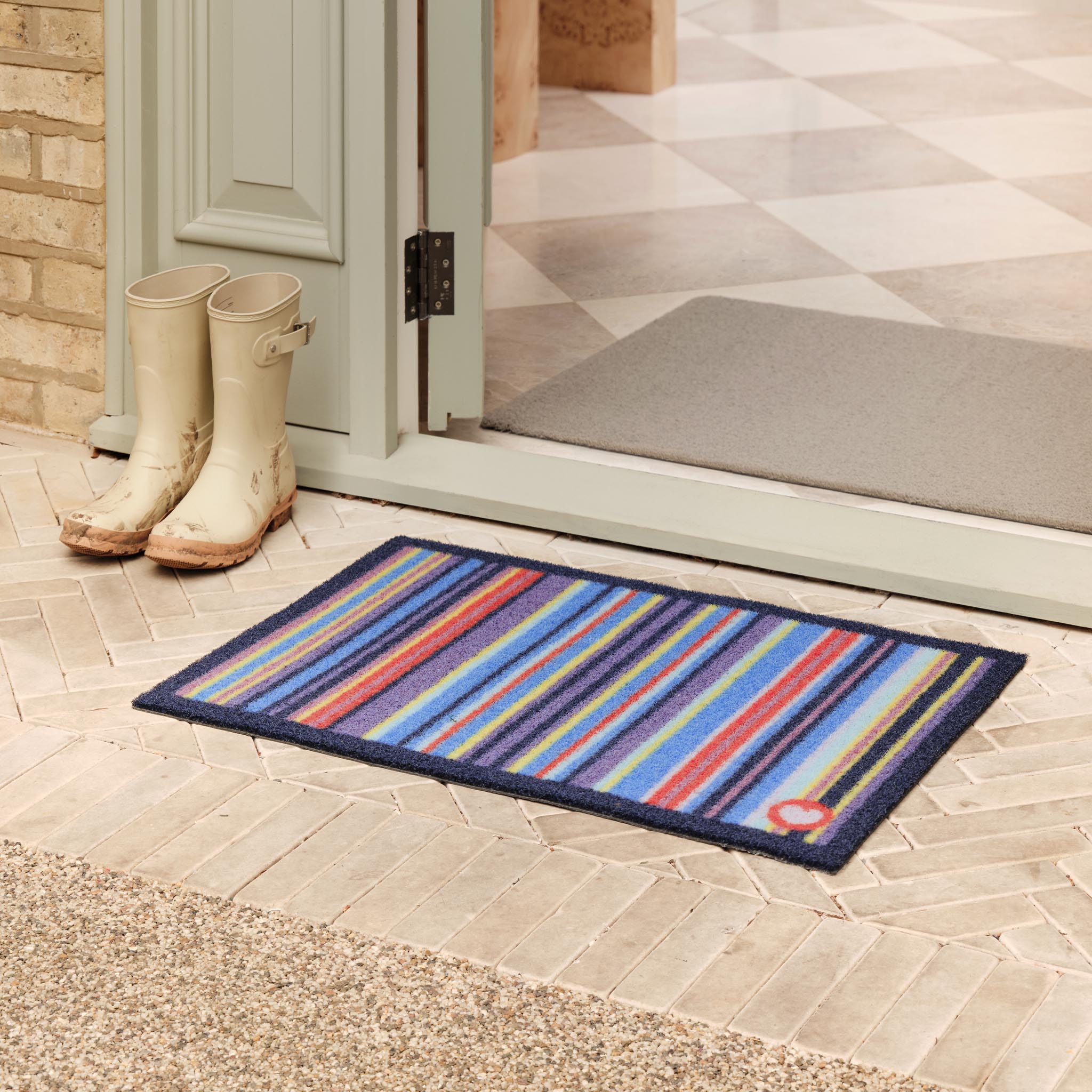 Stripe 85 Outdoor Doormat- 100% recycled nylon outdoor doormat featuring a striped design.