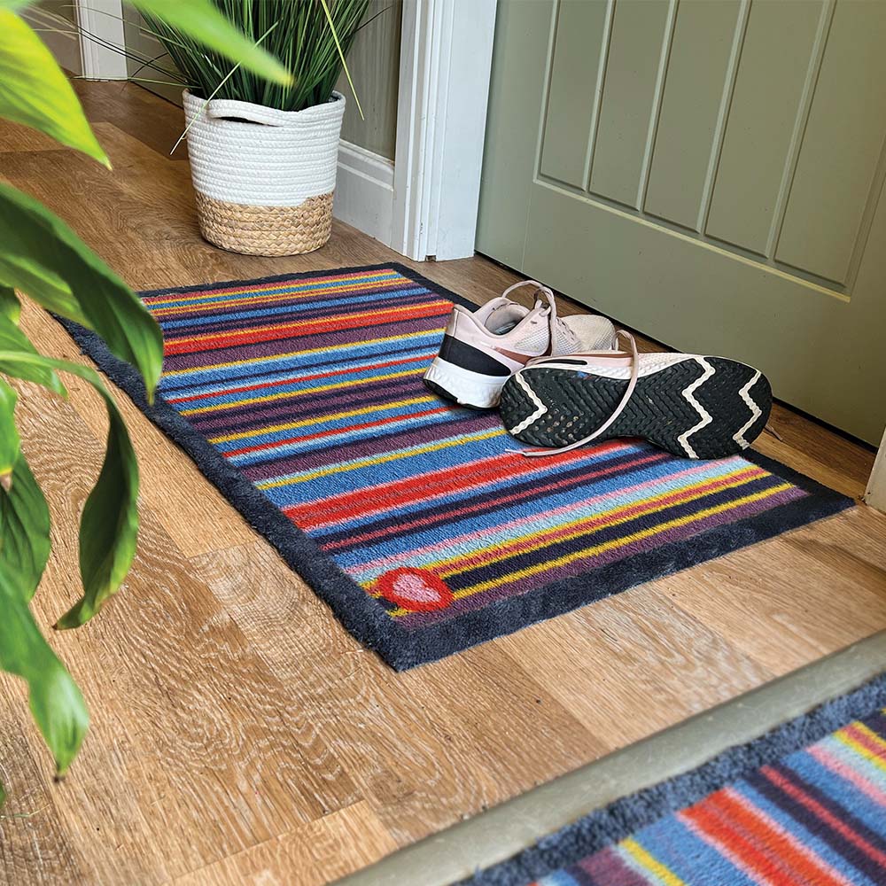 Stripe 85 Multi Washable Doormat made from 100% recycled cotton, featuring a bright striped design. 