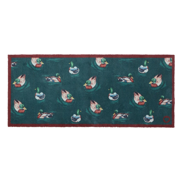 Swimming Ducks Teal Washable Runner- a 100% recycled cotton runner featuring multiple ducks swimming and creating ripples in the water.