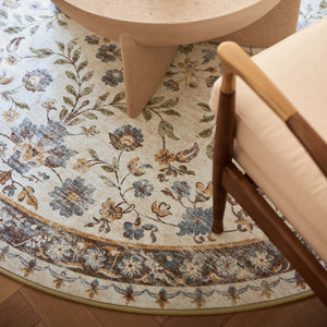 Close-up of Cottage Garden Eco-Washable Circle Rug with a floral design, styled on wooden flooring.