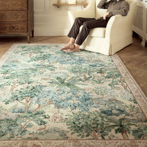 The Stumpery Fern Eco-Washable Rug with a nature inspired pattern, styled in a living room. 