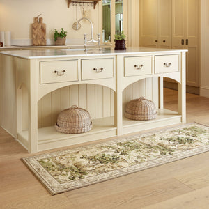 The Stumpery Lichen Eco-Washable Runner with a nature inspired pattern, styled on wooden flooring. 