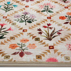 The Wildflower Patch Eco-Washable Runner- a beige eco-washable runner featuring vibrant florals.
