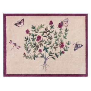 Thyme Walk Lichen & Gooseberry Washable Doormat with a purple floral nature inspired pattern.