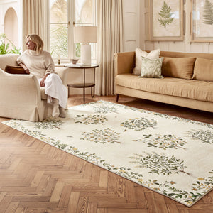 Thyme Walk Lichen & Gooseberry Eco-Washable Rug with a nature inspired pattern, styled in the living room.
