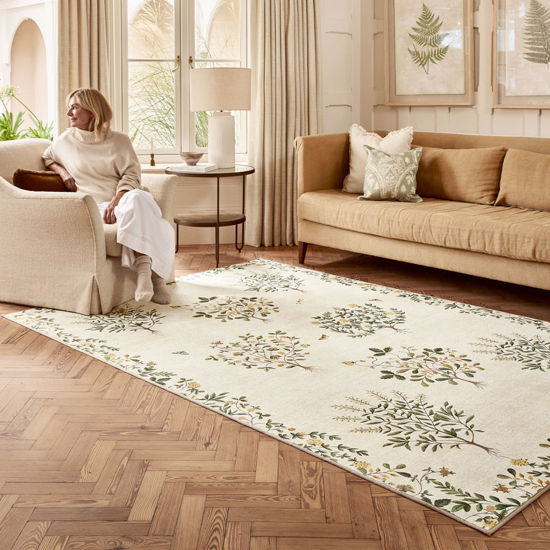 Thyme Walk Lichen & Gooseberry Eco-Washable Rug with a nature inspired pattern, styled in the living room.