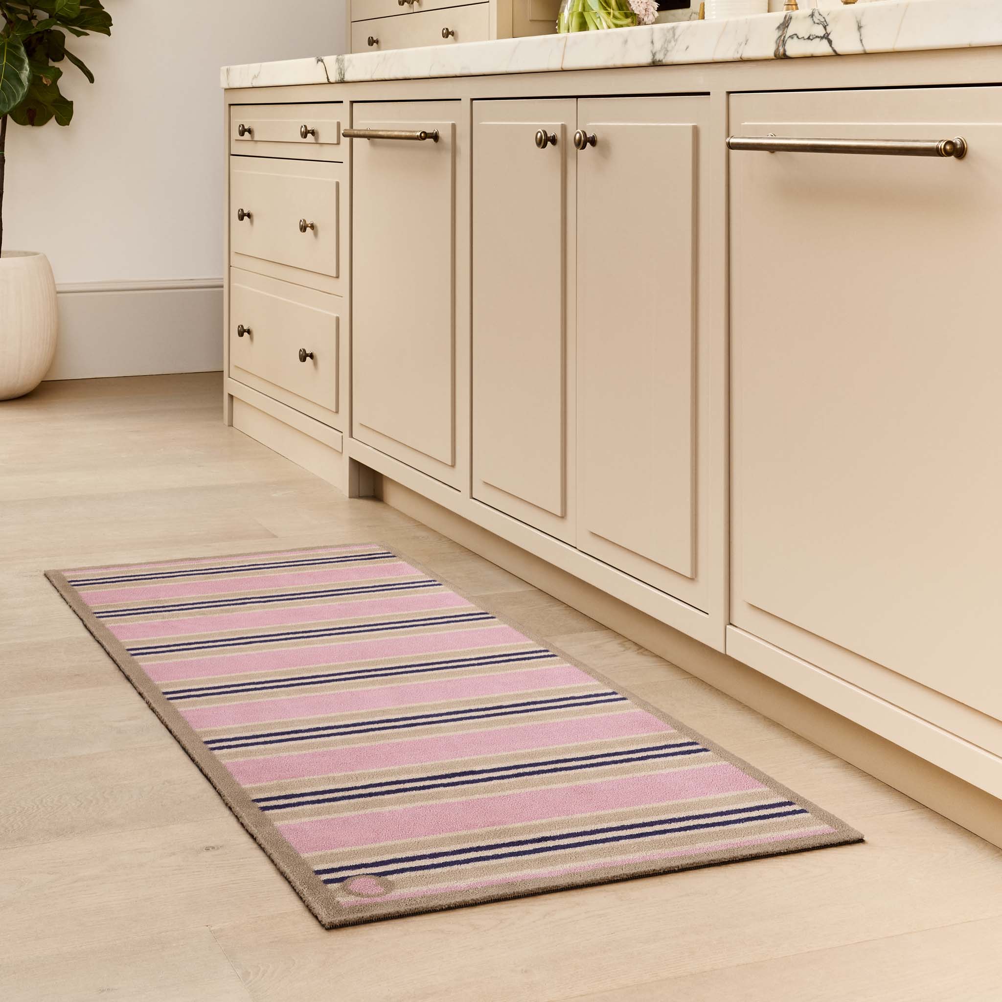 Timeless Stripe Blush Runner with a beige and pink stripe pattern, styled in a kitchen.