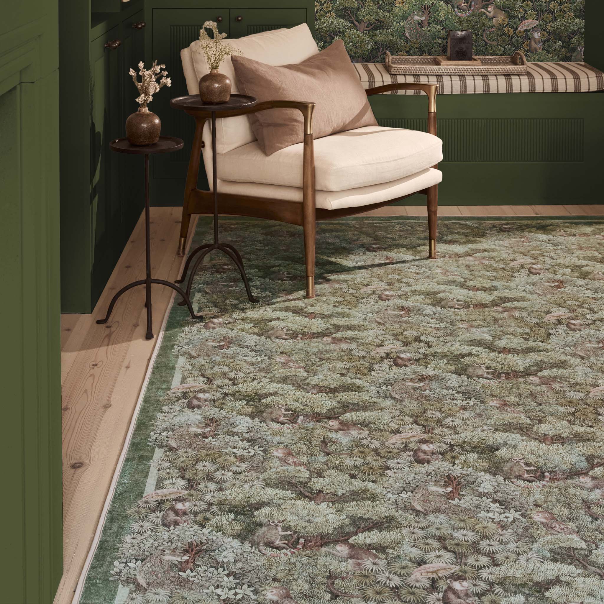 Treetop Troop Green Eco-Washable Rug with a forest and forest animal design, styled on wooden flooring.