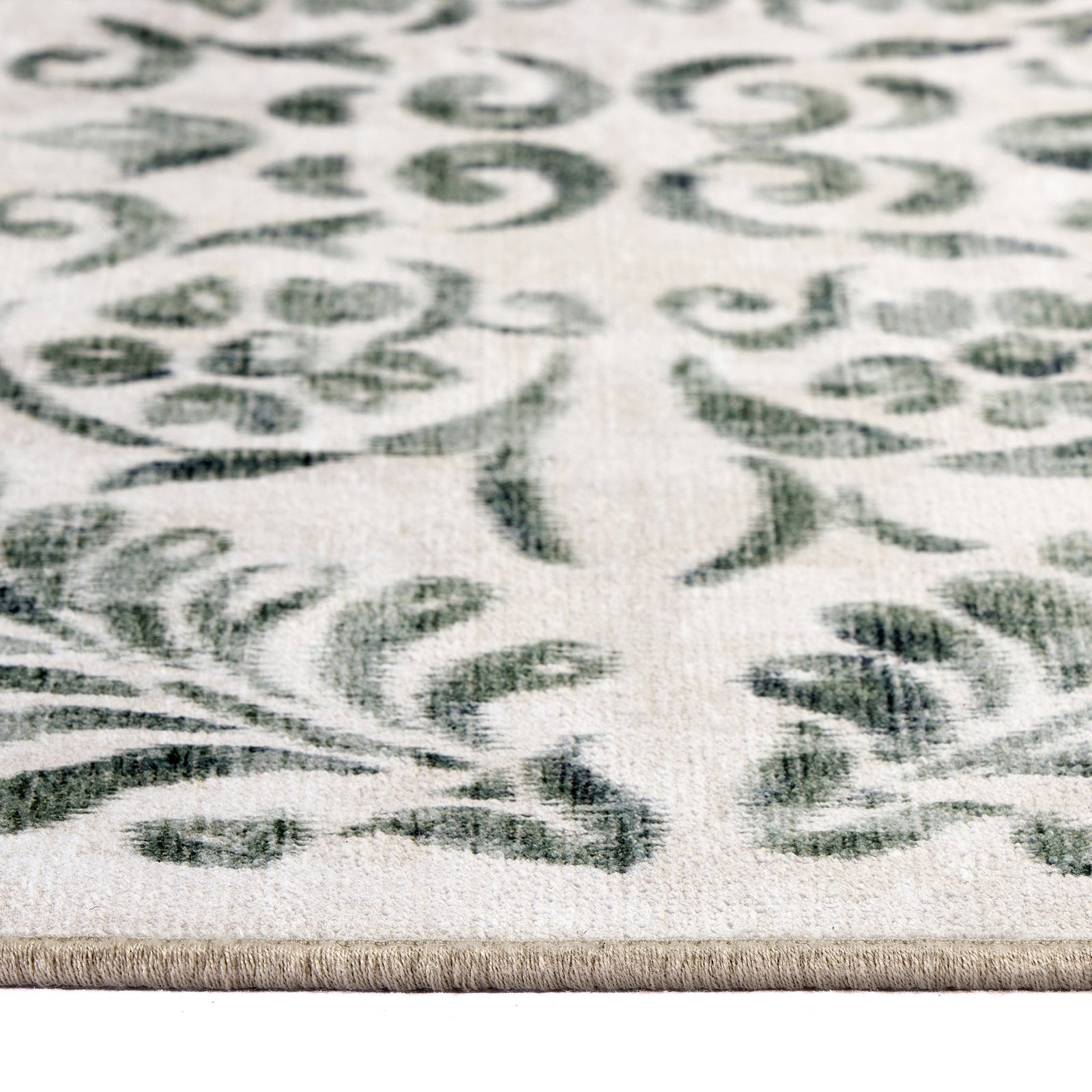 Vintage Scroll Green Eco Washable Rug made from 100% recycled materials, featuring an intertwined green floral design. 