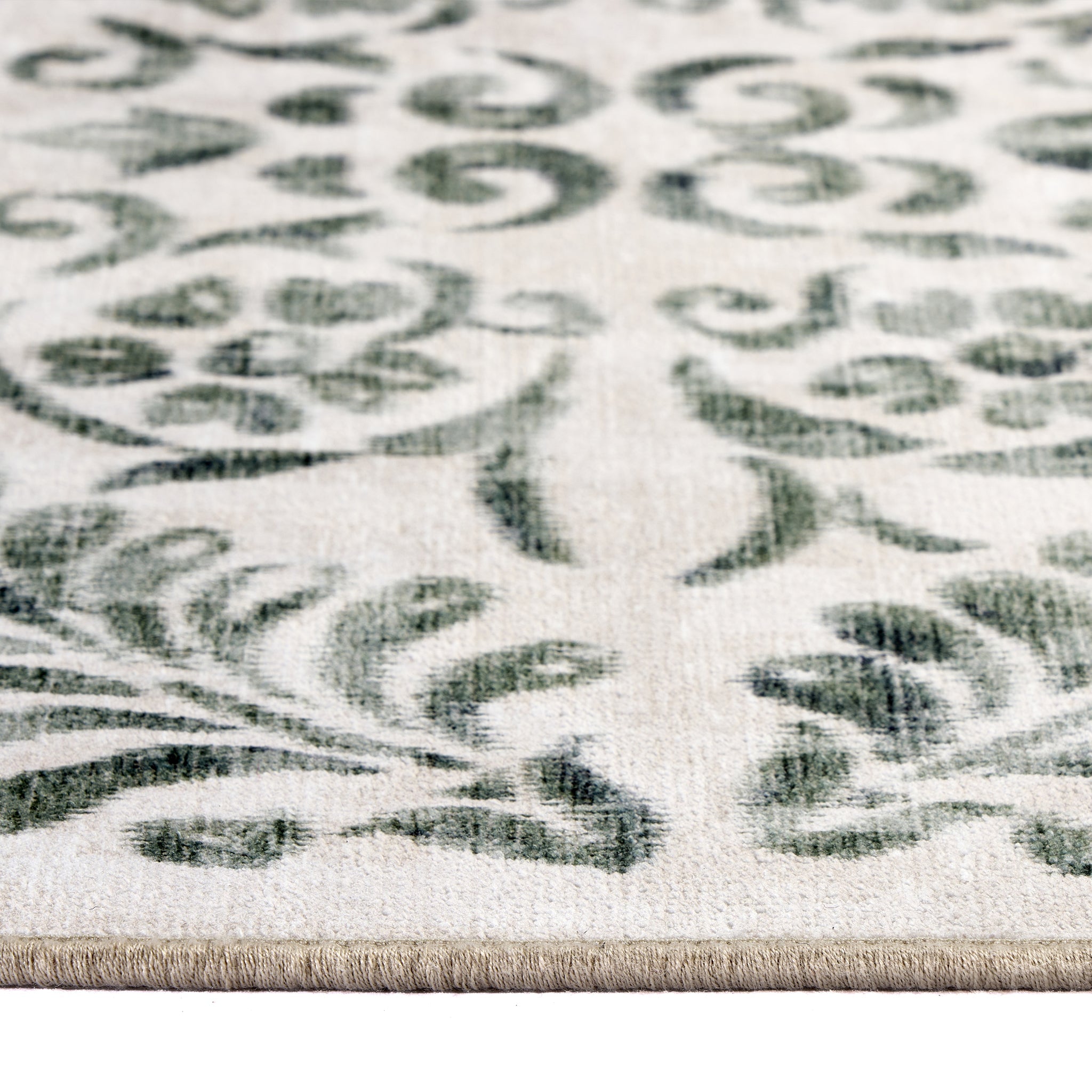 Vintage Scroll Green Eco Washable Rug made from 100% recycled materials, featuring an intertwined green floral design. 