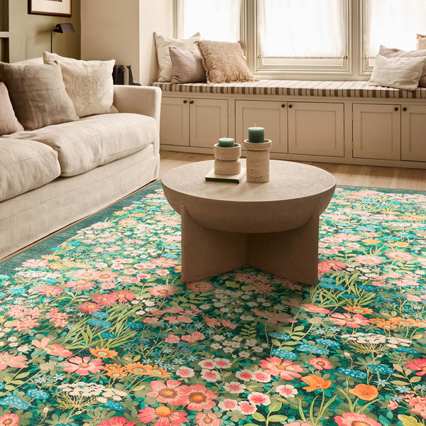 Wallflower Emerald Eco-Washable Runner in Green with a floral design, styled in a living room.