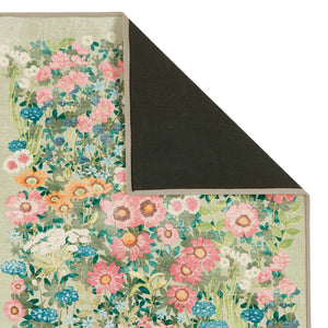 Close-up of Wallflower Sage Eco-Washbale Rug in Green showing backing.