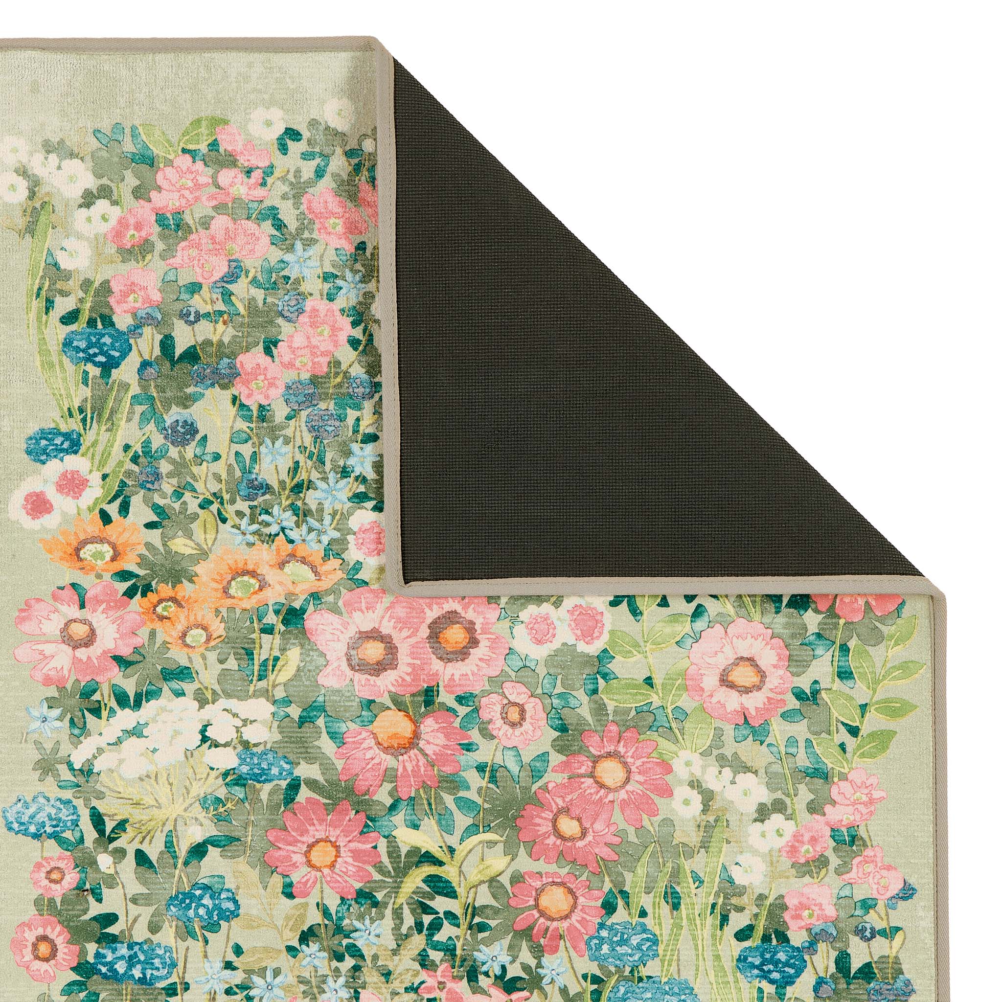 Close-up of Wallflower Sage Eco-Washbale Rug in Green showing backing.