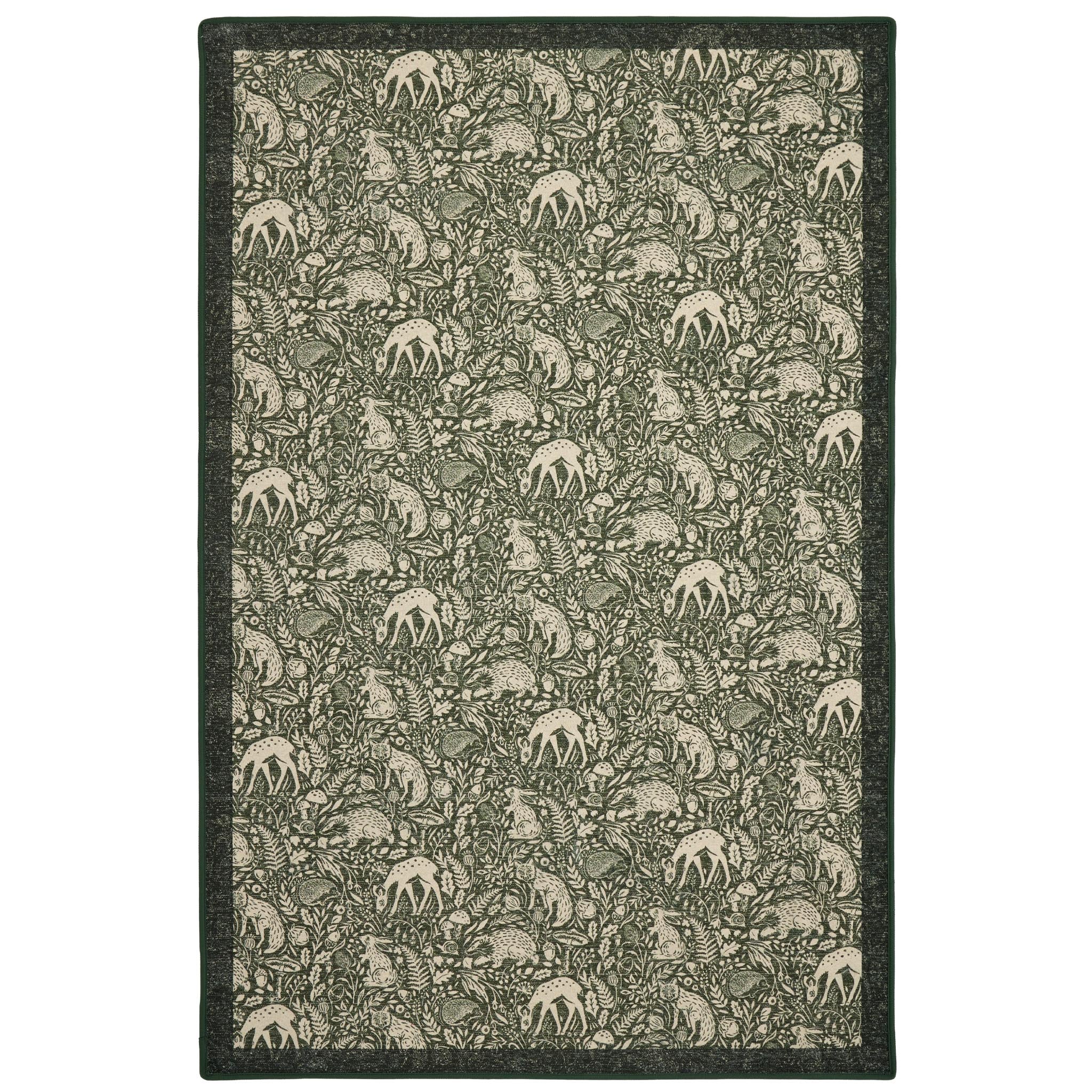 Whimsical Woodland Eco-Washable Rug – a green eco-washable rug featuring white woodland animals and white florals.