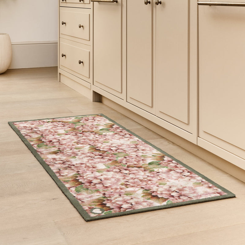 Wild Hydrangea Washable Runner- a 100% recycled cotton runner featuring hydrangea blooms in rust and soft pinks.