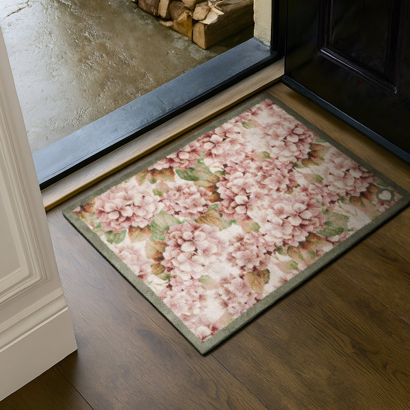 Wild Hydrangea Washable Doormat- a 100% recycled cotton doormat featuring hydrangea blooms in rust and soft pinks.