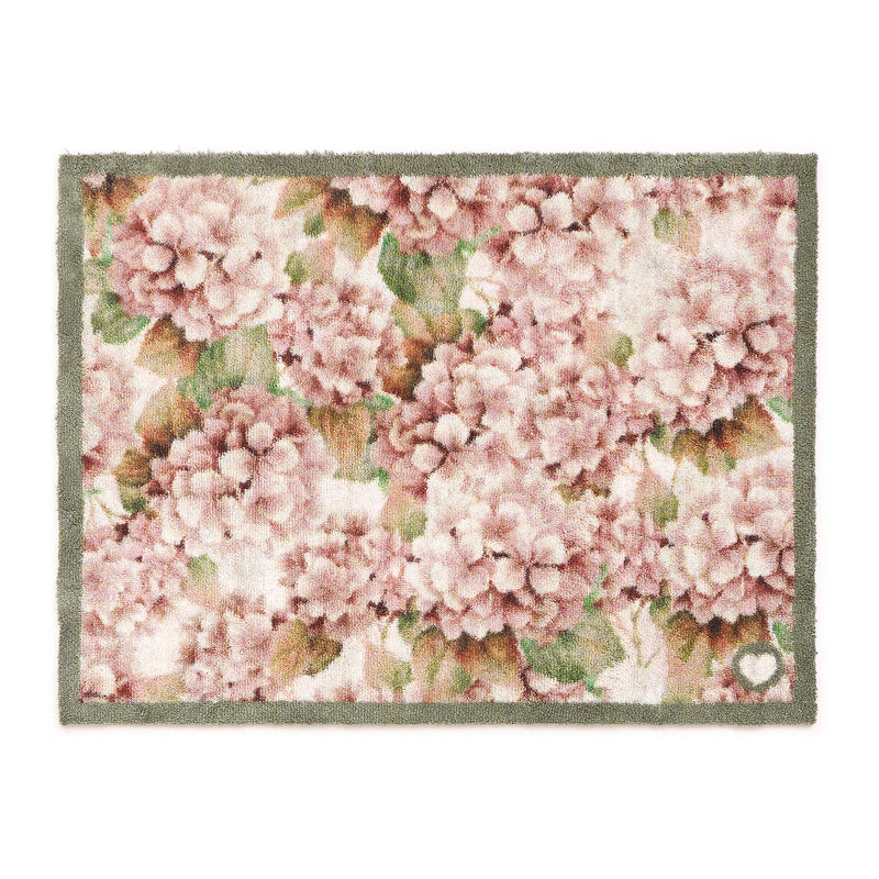 Wild Hydrangea Washable Doormat- a 100% recycled cotton doormat featuring hydrangea blooms in rust and soft pinks.