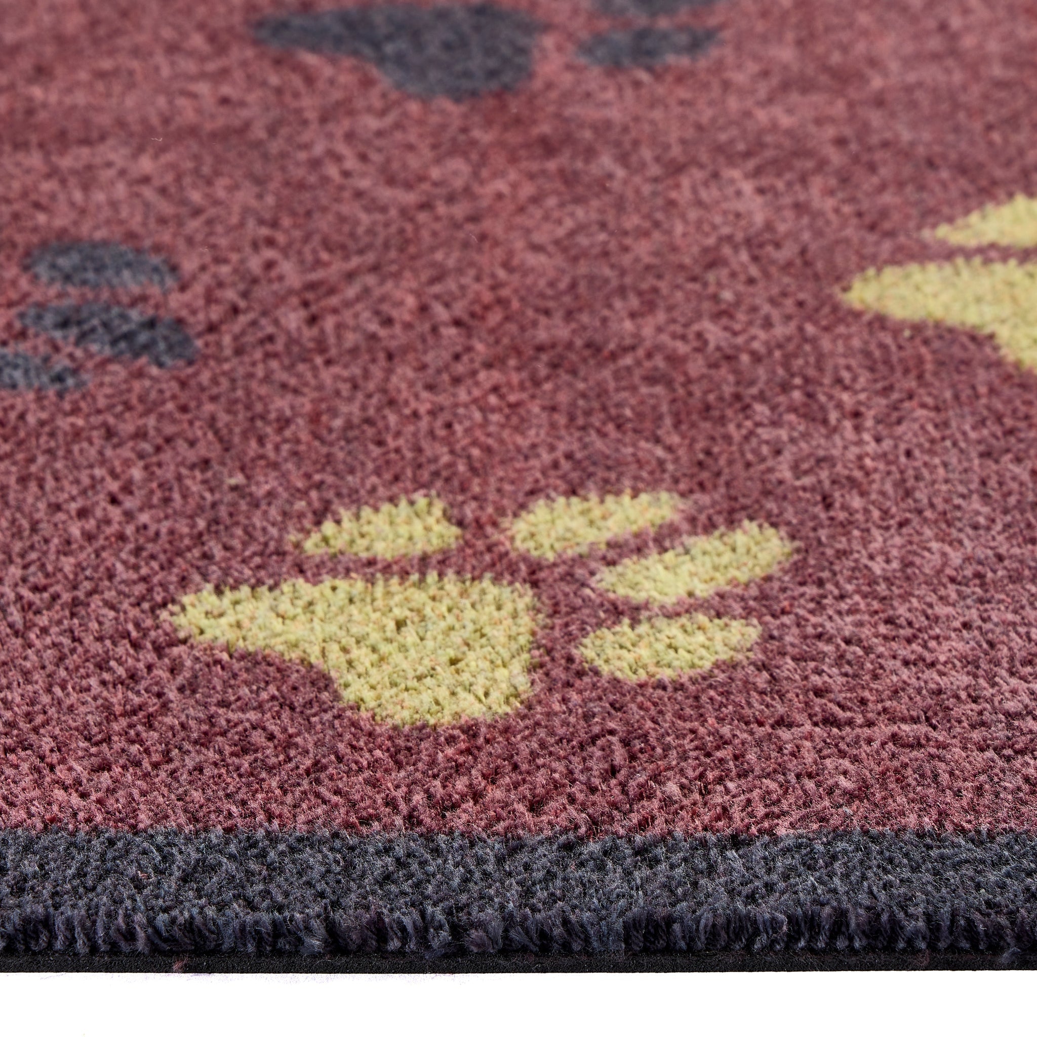  Wipe Your Paws Burgundy Runner in a dark red- a 100% recycled cotton runner featuring scattered paw prints in dark navy, light green, and beige. 