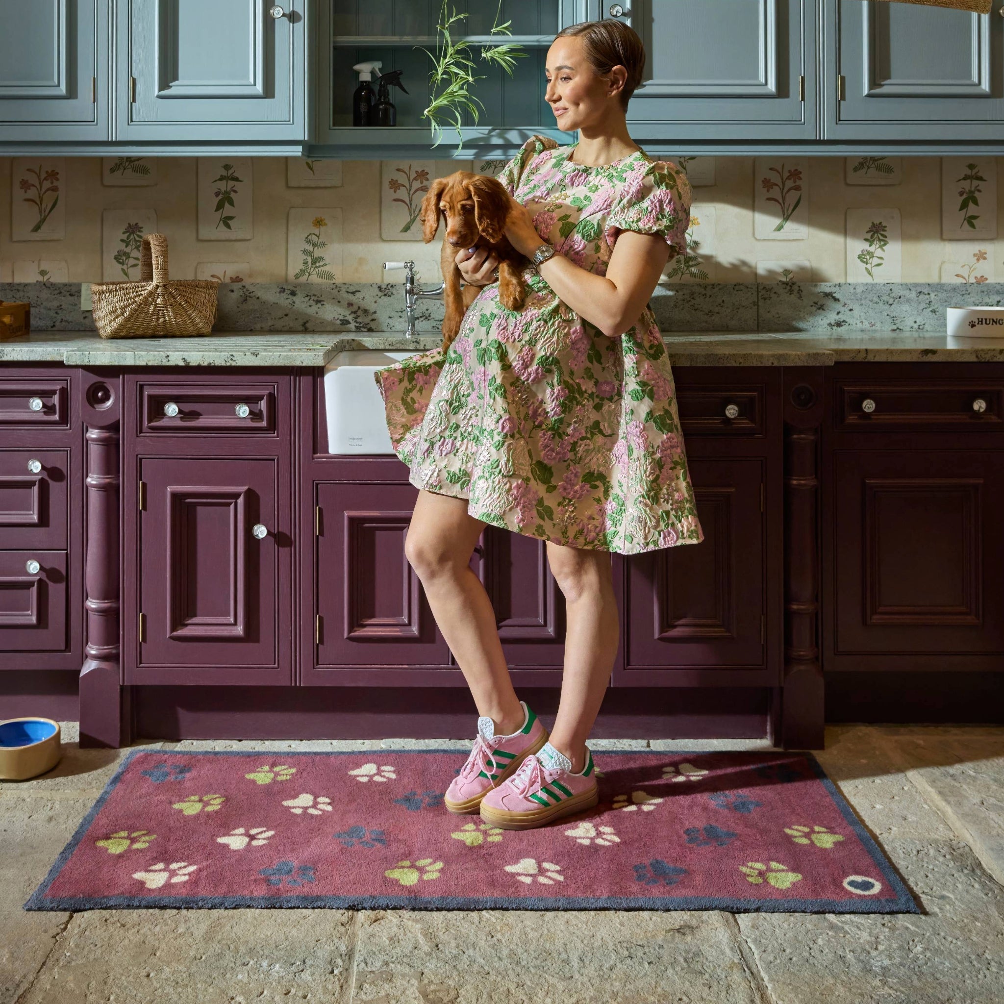  Wipe Your Paws Burgundy Runner in a dark red- a 100% recycled cotton runner featuring scattered paw prints in dark navy, light green, and beige. 