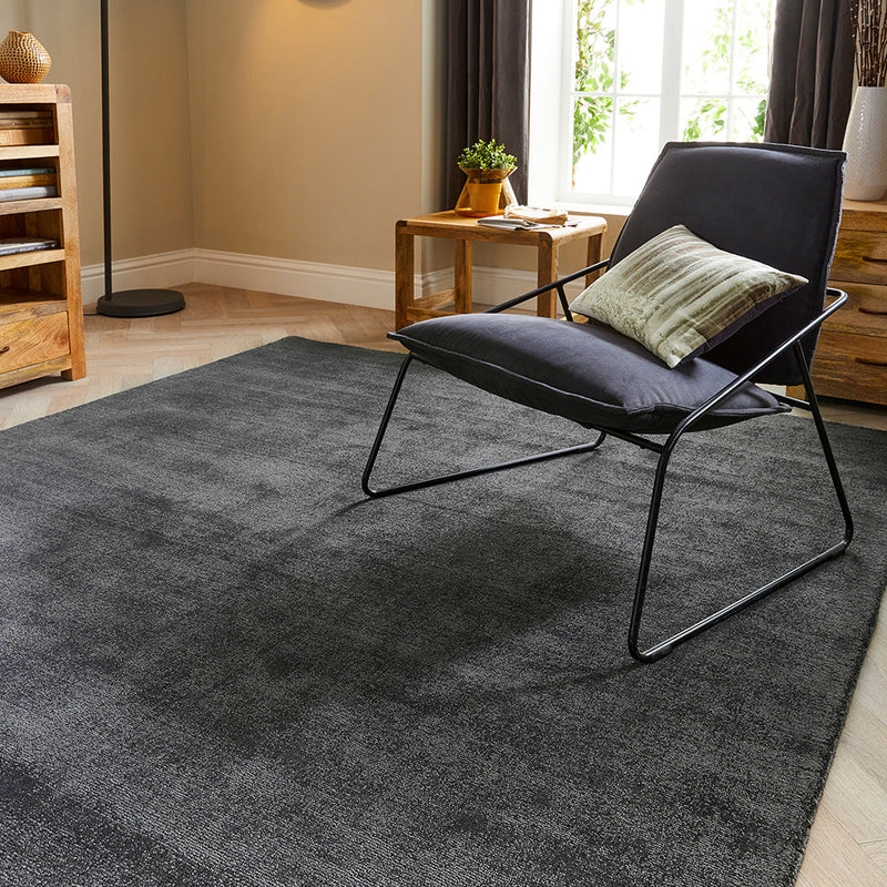 Reef Dark Grey Rug made from 100% recycled materials in a solid dark grey colour.  
