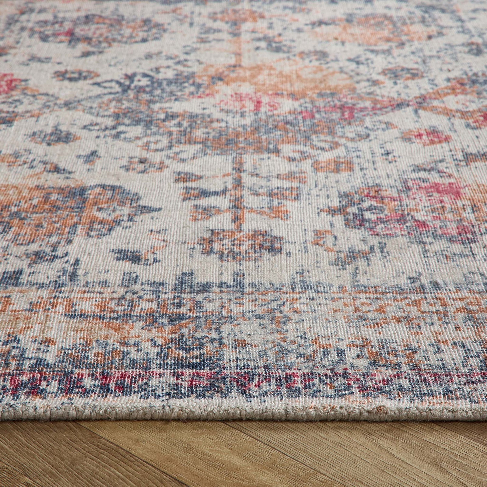 Vogue Navy/Rust Rug made from 100% PET Recycled materials, featuring a worn out vintage inspired pattern. 