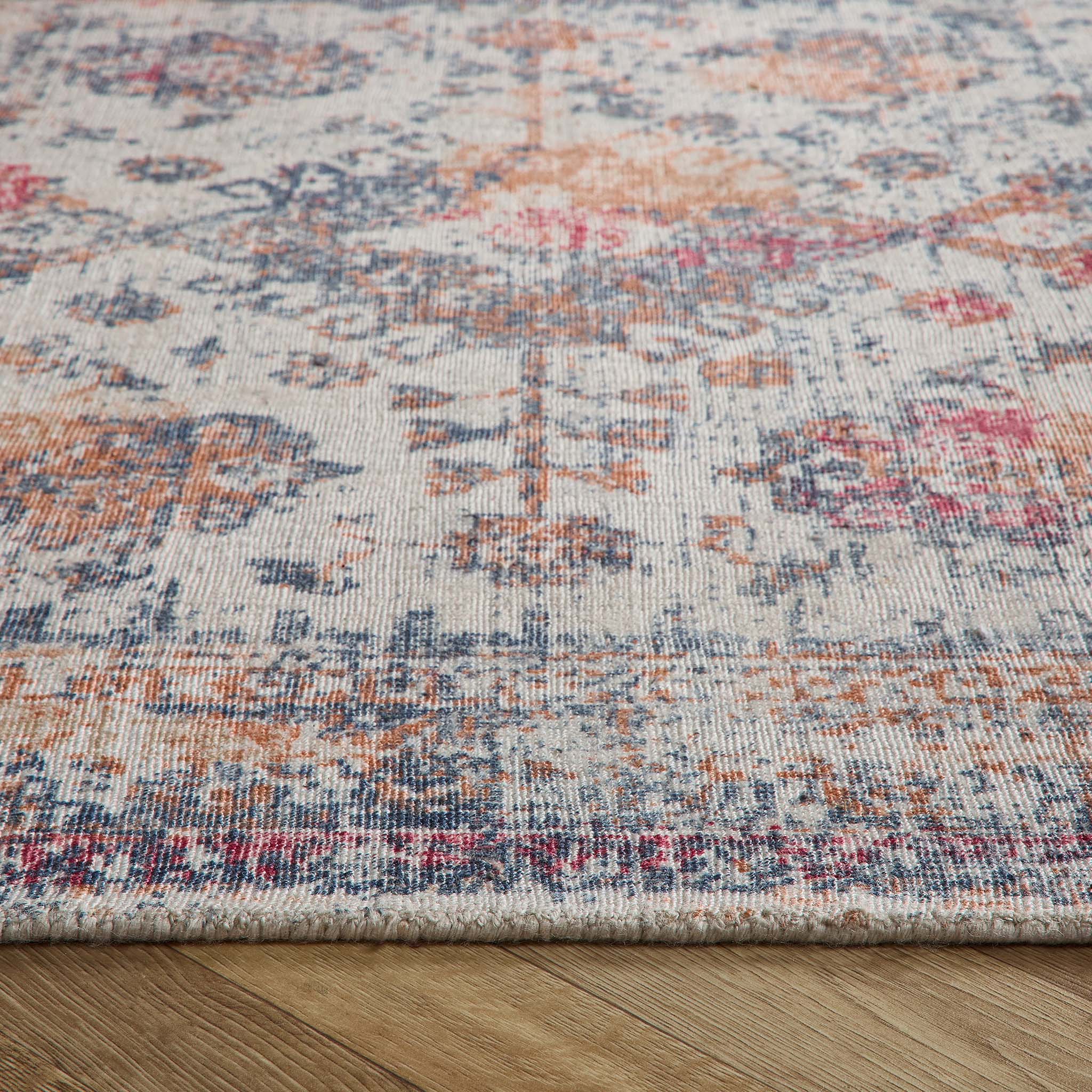 Vogue Navy/Rust Rug made from 100% PET Recycled materials, featuring a worn out vintage inspired pattern. 