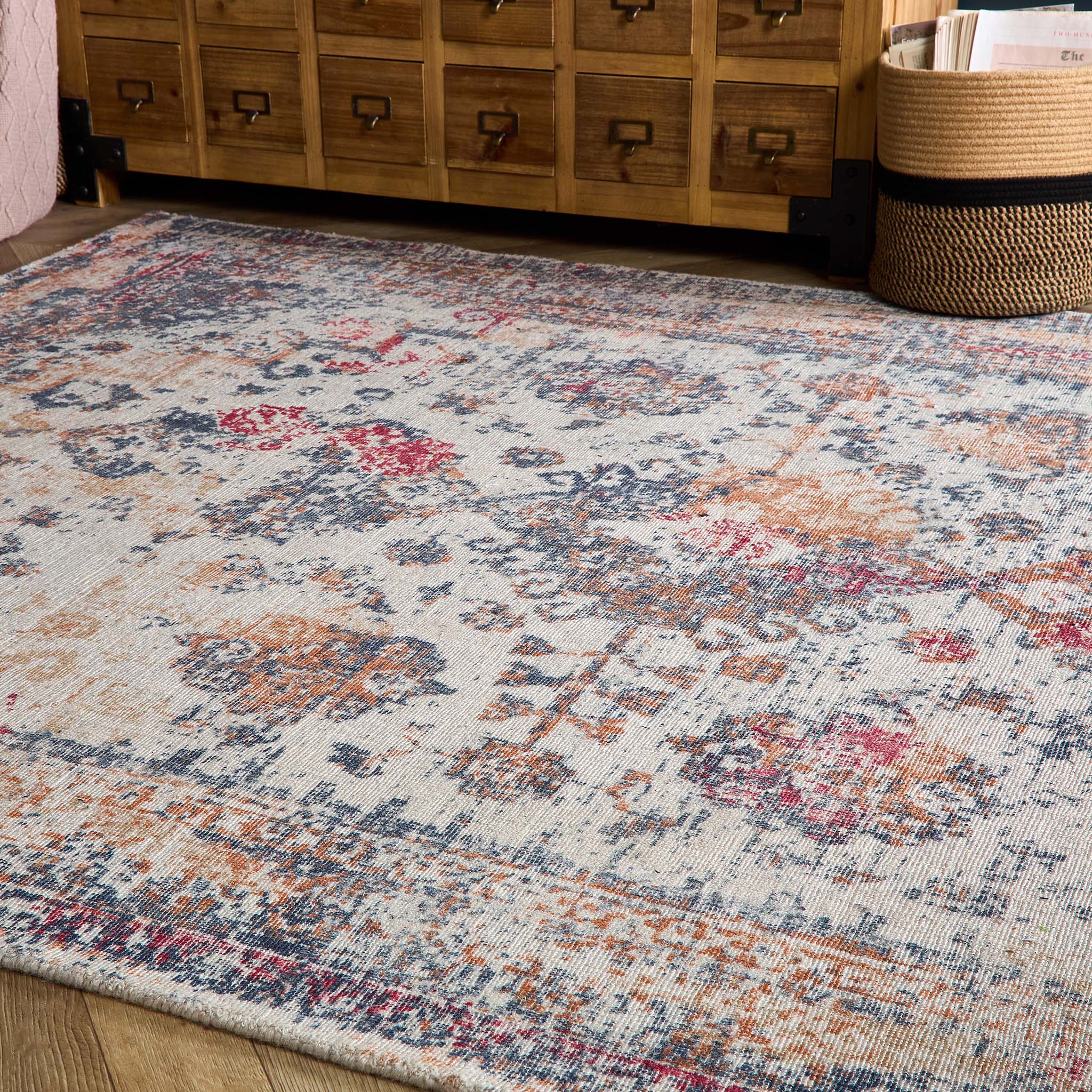 Vogue Navy/Rust Rug made from 100% PET Recycled materials, featuring a worn out vintage inspired pattern. 