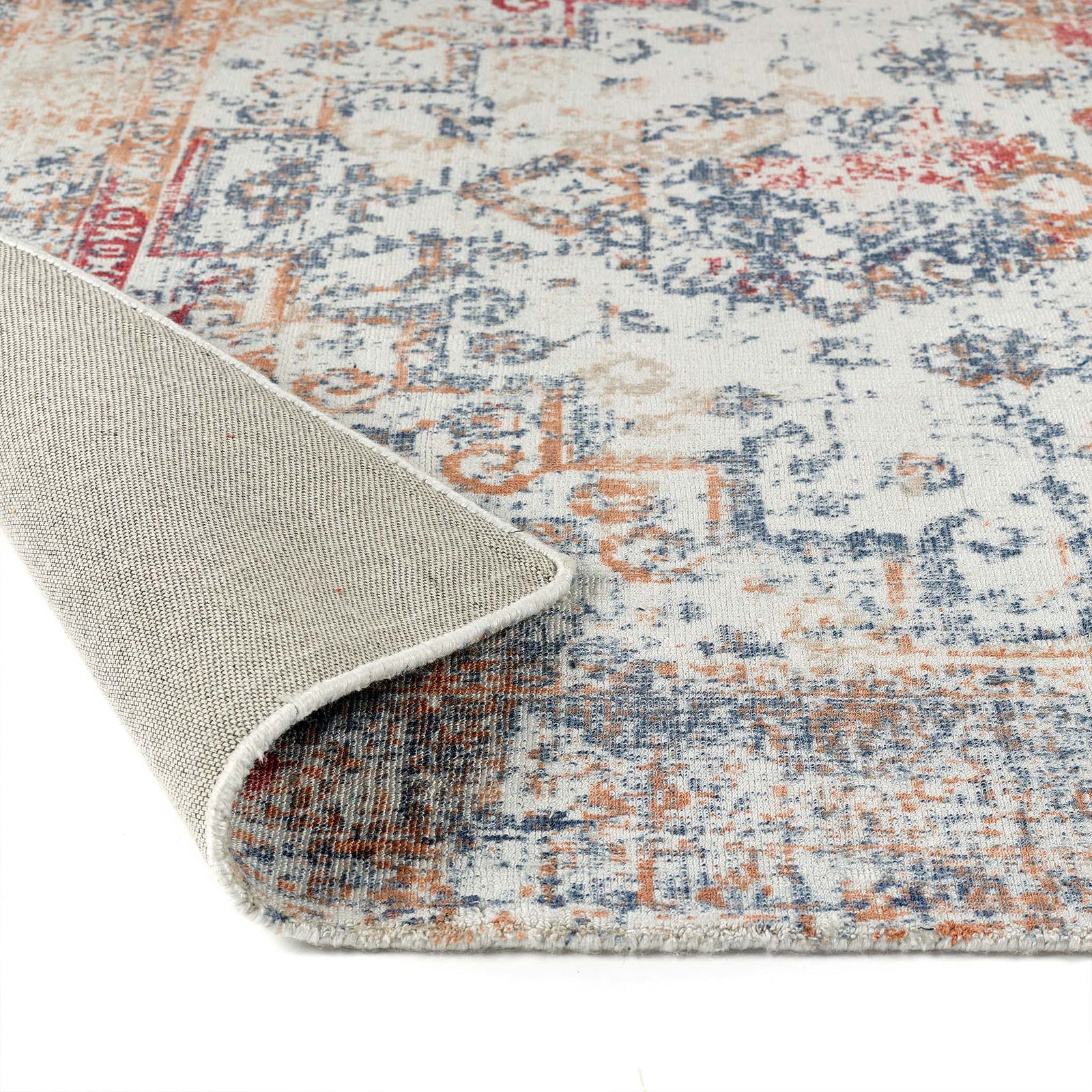 Vogue Navy/Rust Rug made from 100% PET Recycled materials, featuring a worn out vintage inspired pattern. 