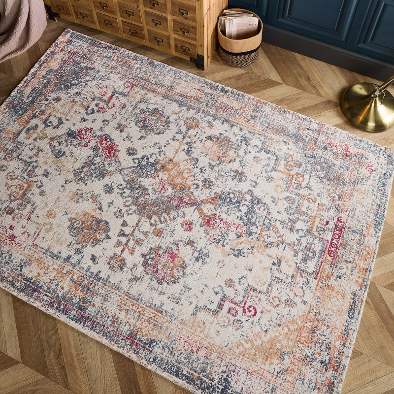Vogue Navy/Rust Rug made from 100% PET Recycled materials, featuring a worn out vintage inspired pattern. 