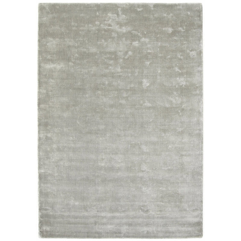 Karma Cloud Grey Rug made from 100% viscose, featuring different shades of light and dark cream.