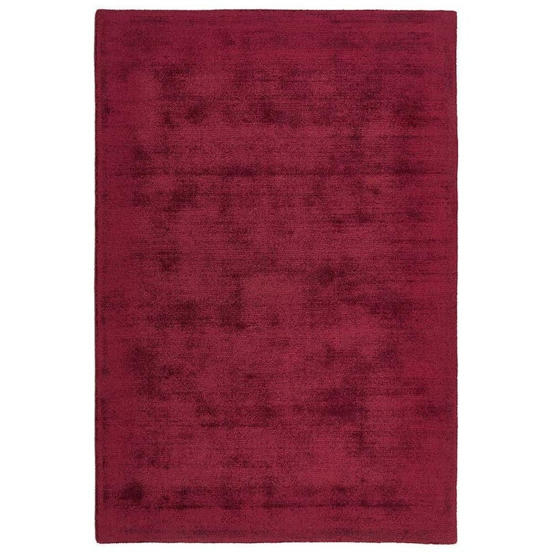 Reef Raspberry Rug made from 100% recycled materials in a solid dark pink colour.